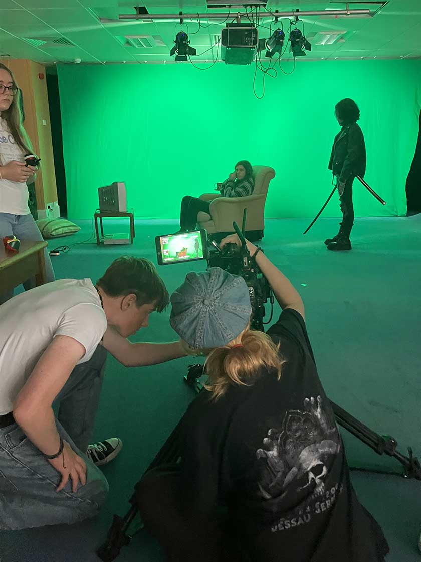 Lettie and Joey setting up for a greenscreen shot