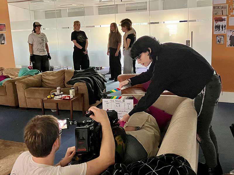 Tom filming with Hannah on slate