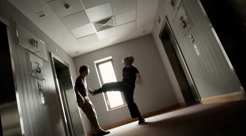 Lettie kicking Henry down the lift shaft